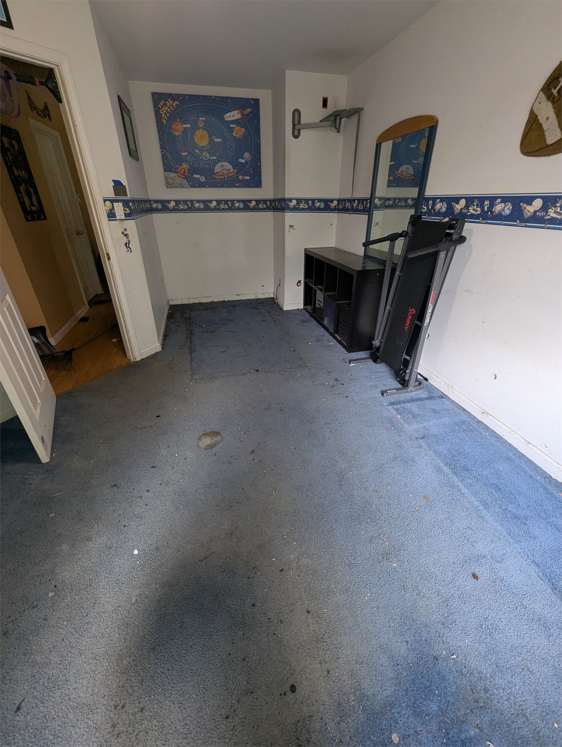 Bedroom mostly cleared during an apartment cleanout