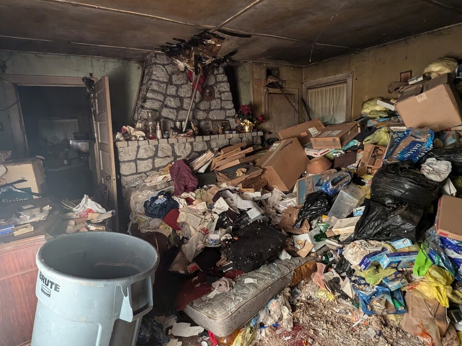Fireplace room before full cleanout