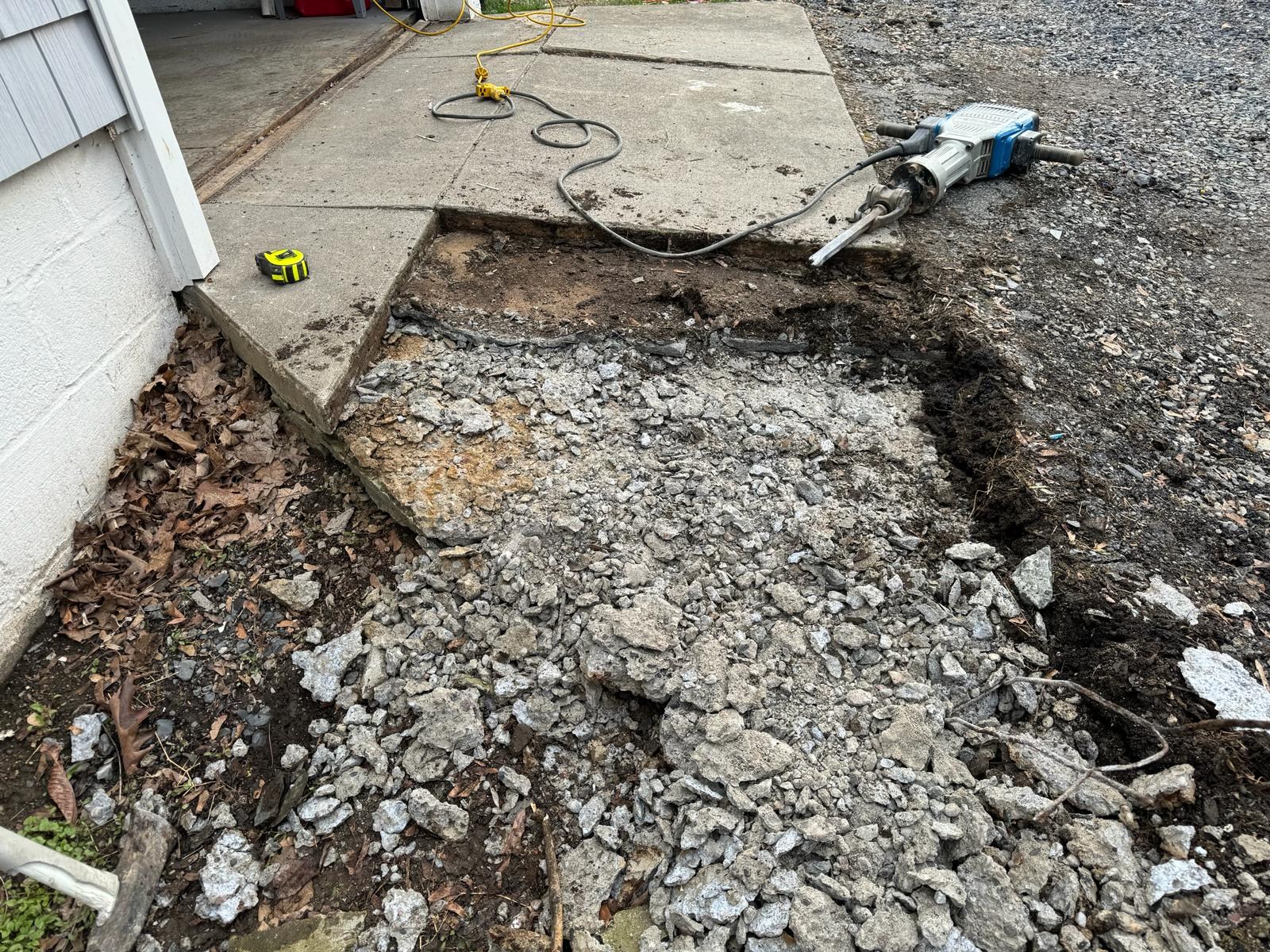 Crew breaking up concrete for removal