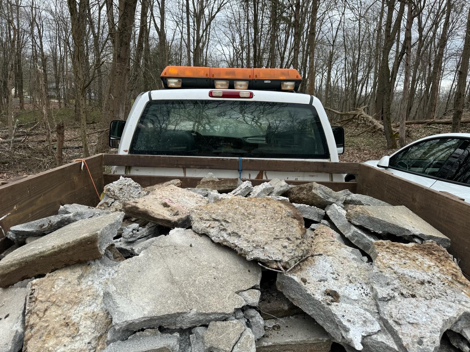 Broken concrete loaded for removal