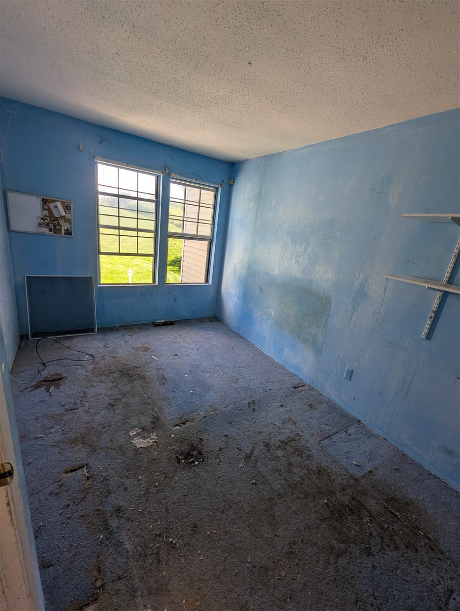 Cleared bedroom after a full-property cleanout near Whispering Hills in Chester