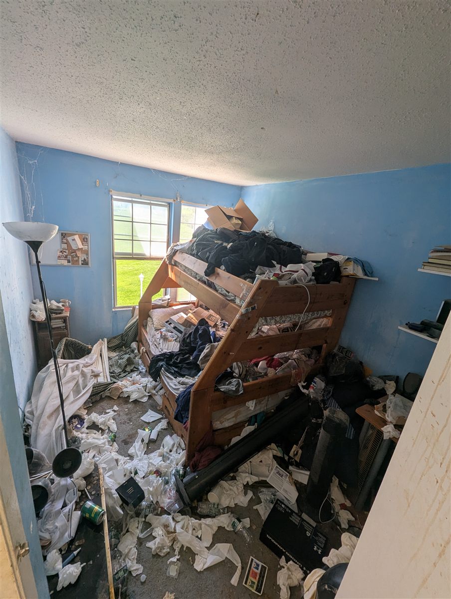 Packed bedroom before a full-property cleanout near Whispering Hills in Chester