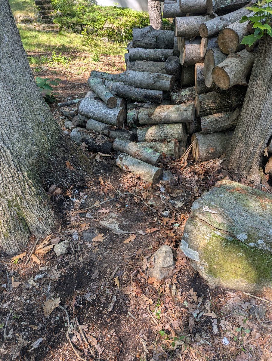 Cleared rocky property edge after debris cleanup near Southfields, New York