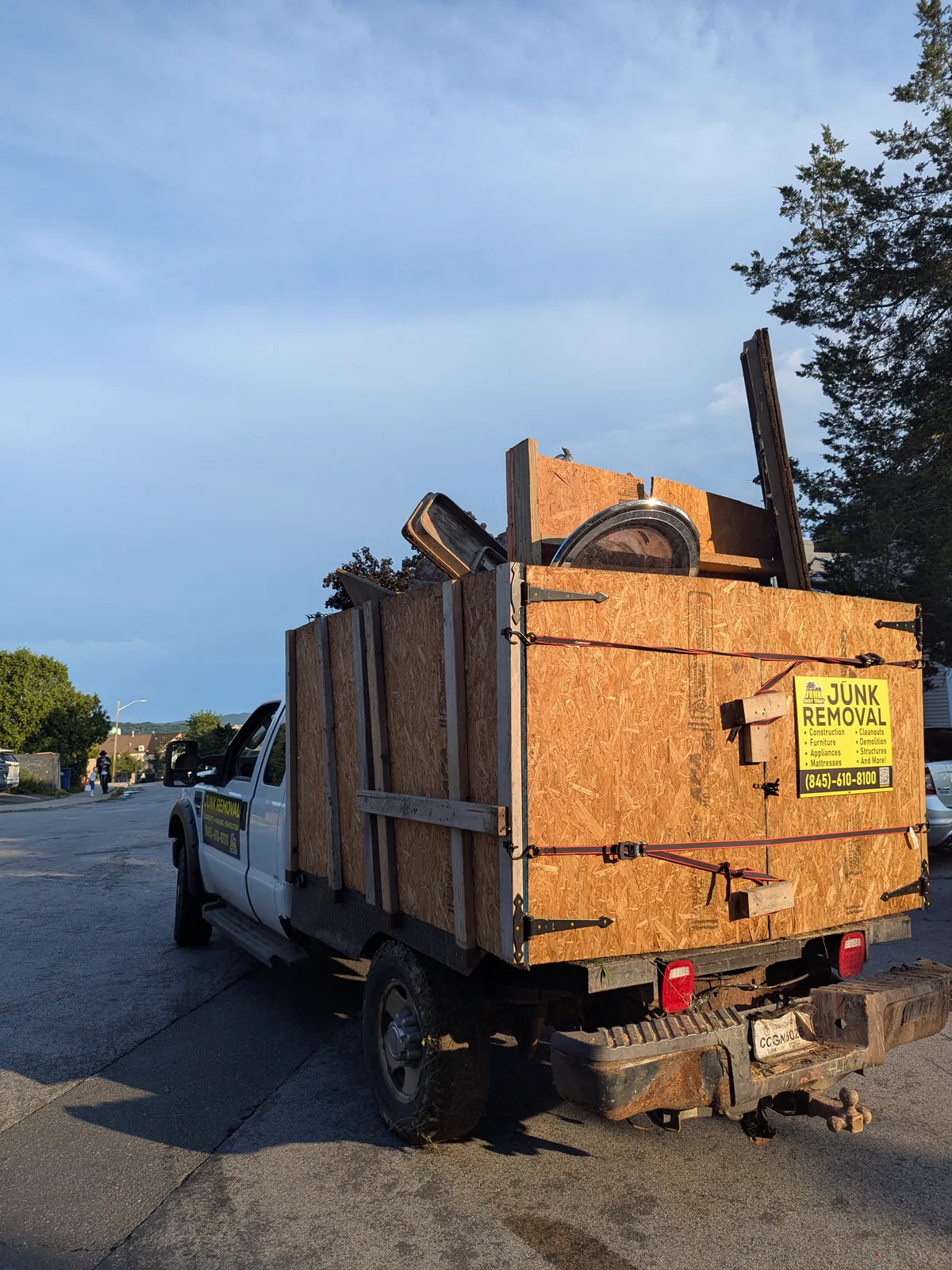 Junk Away Today truck loaded with dismantled shed debris